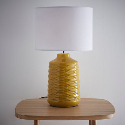 Ivy Ceramic Table Lamp With White Linen Shade and a wave design textured base