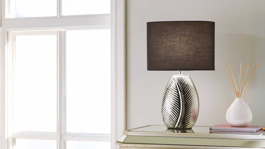 Modern bedroom with stylish bedside lamps and warm ambient lighting