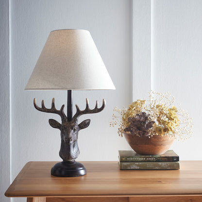 Antlers Stag Head Animal Table Lamp in an Antique Copper Table Lamp with a Natural Linen Lampshade