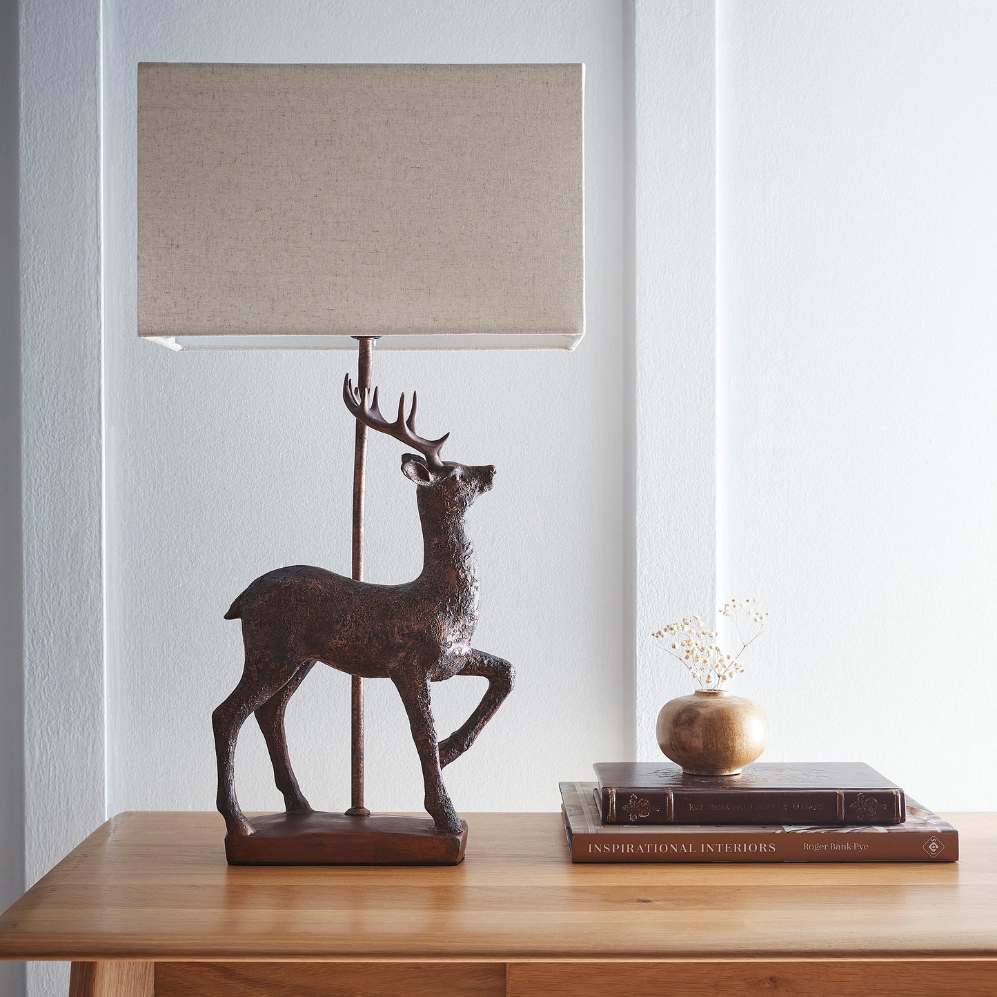 Stag Table Lamp in an Antique Copper Resin Table Lamp with a Natural Linen Lampshade