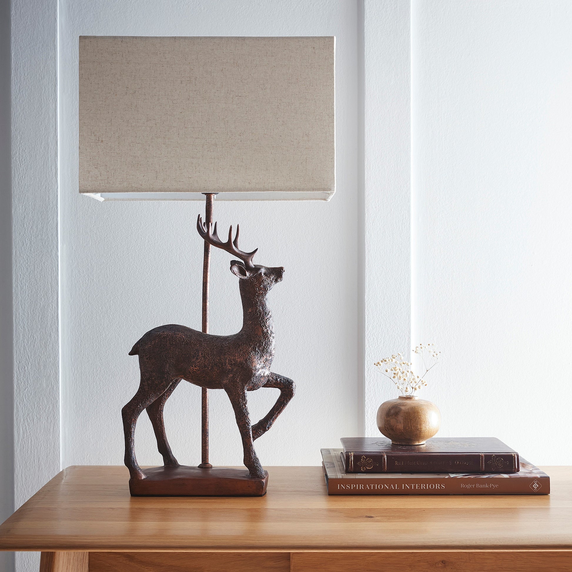 Stag Table Lamp in an Antique Copper Resin Table Lamp with a Natural Linen Lampshade