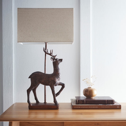Stag Table Lamp in an Antique Copper Resin Table Lamp with a Natural Linen Lampshade
