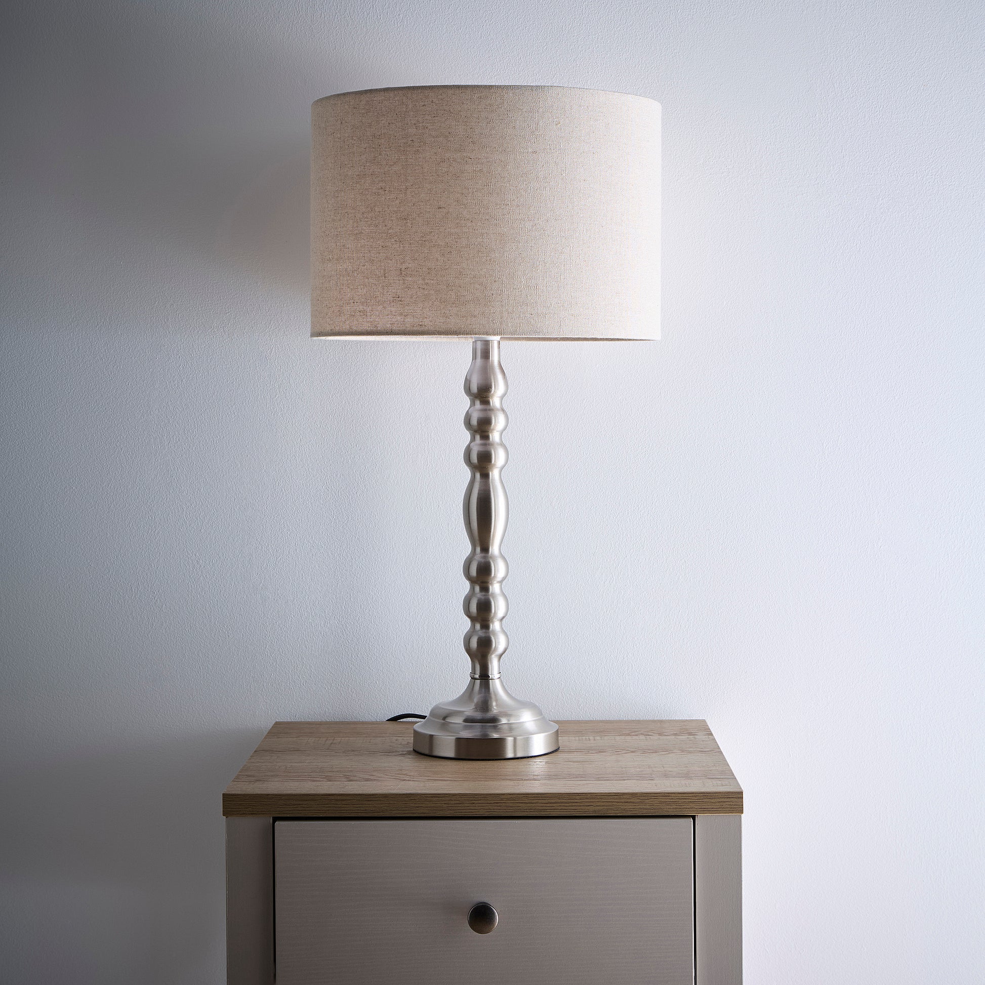 Rosa Satin Nickel Table Lamp on a Candlestick Design with a Natural Linen Lampshade