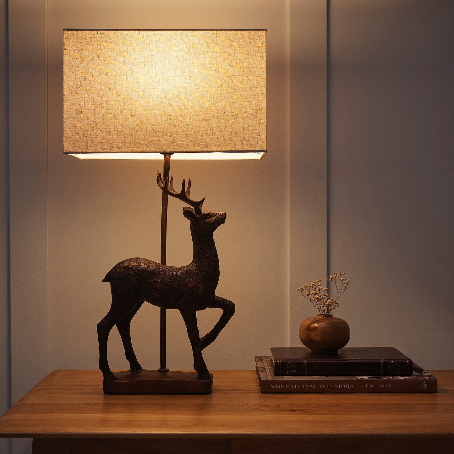 Stag Table Lamp in an Antique Copper Resin Table Lamp with a Natural Linen Lampshade