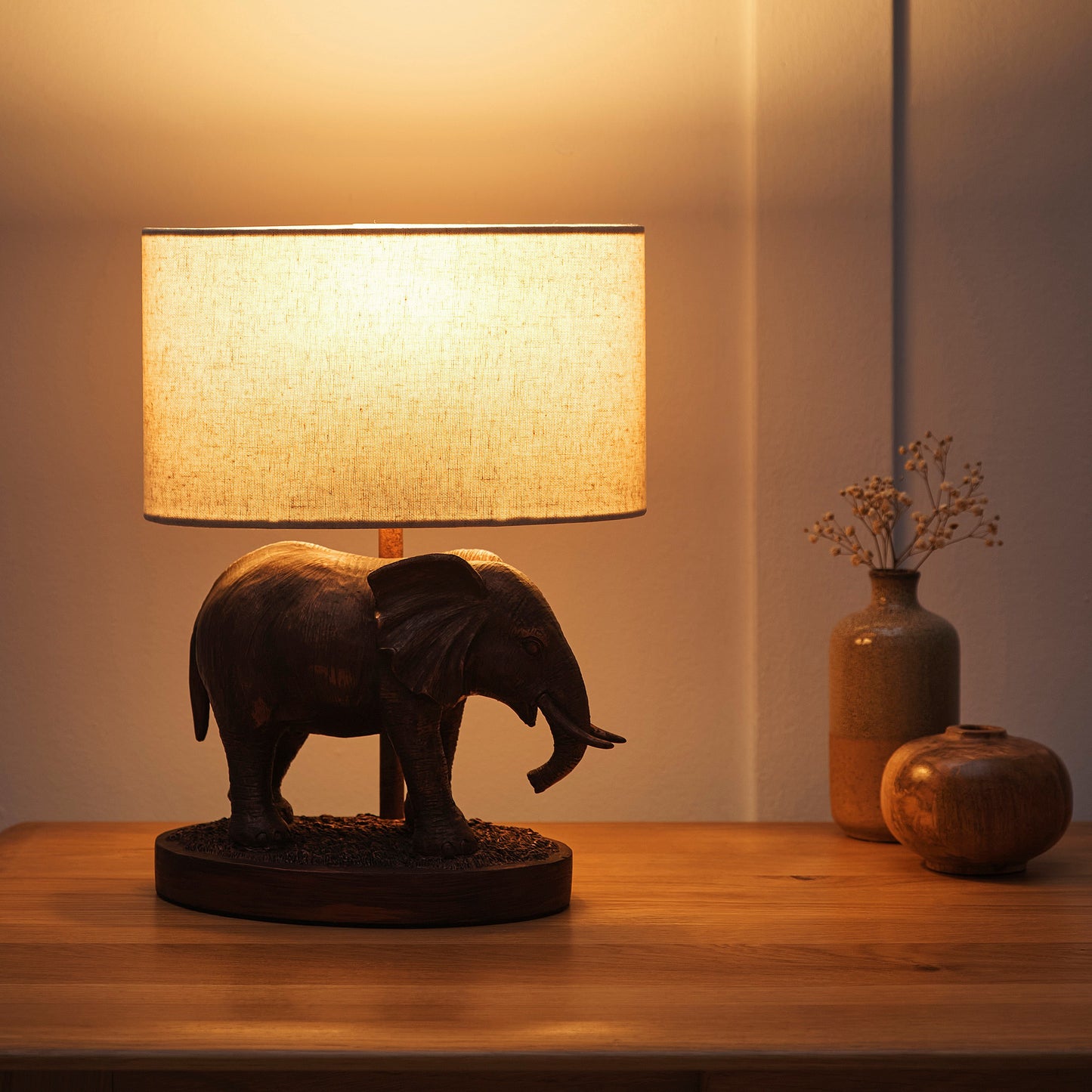 Elephant Lamp in an Antique Copper Resin Table Lamp with an Oval Natural Linen Shade