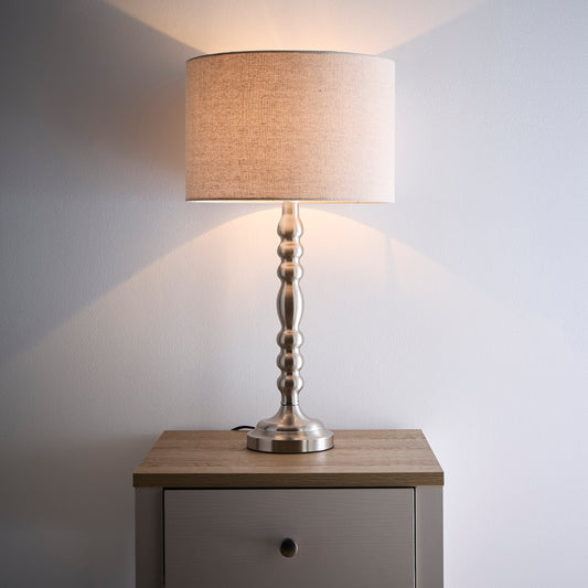 Rosa Satin Nickel Table Lamp on a Candlestick Design with a Natural Linen Lampshade