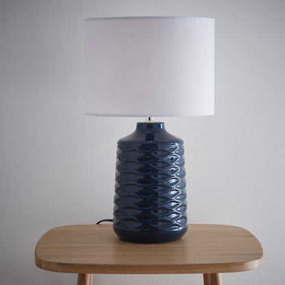 Ivy Ceramic Table Lamp With White Linen Shade and a wave design textured base
