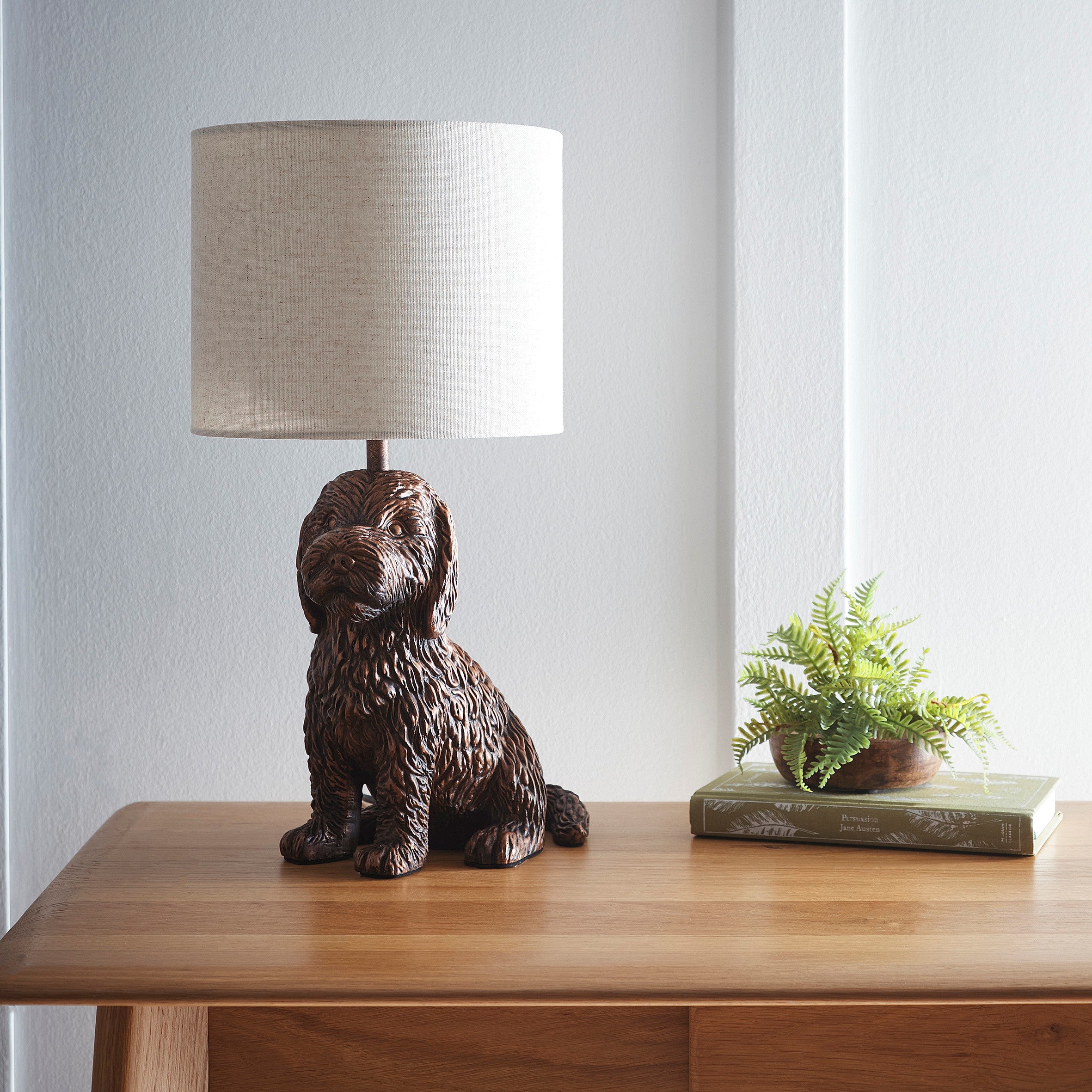 Puppy Animal Table Lamp in an Antique Copper Finish with a Natural Linen Shade