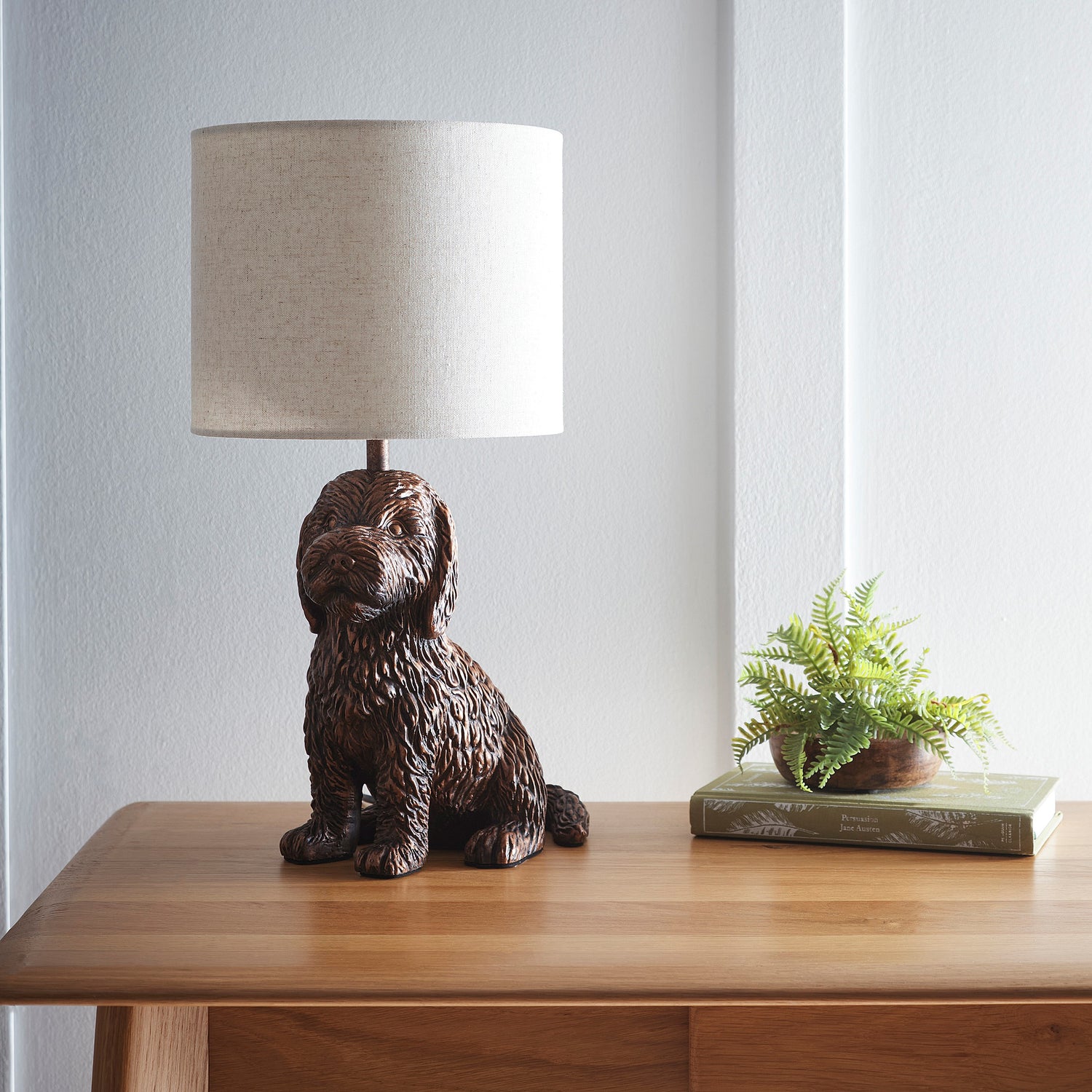 Puppy Animal Table Lamp in an Antique Copper Finish with a Natural Linen Shade