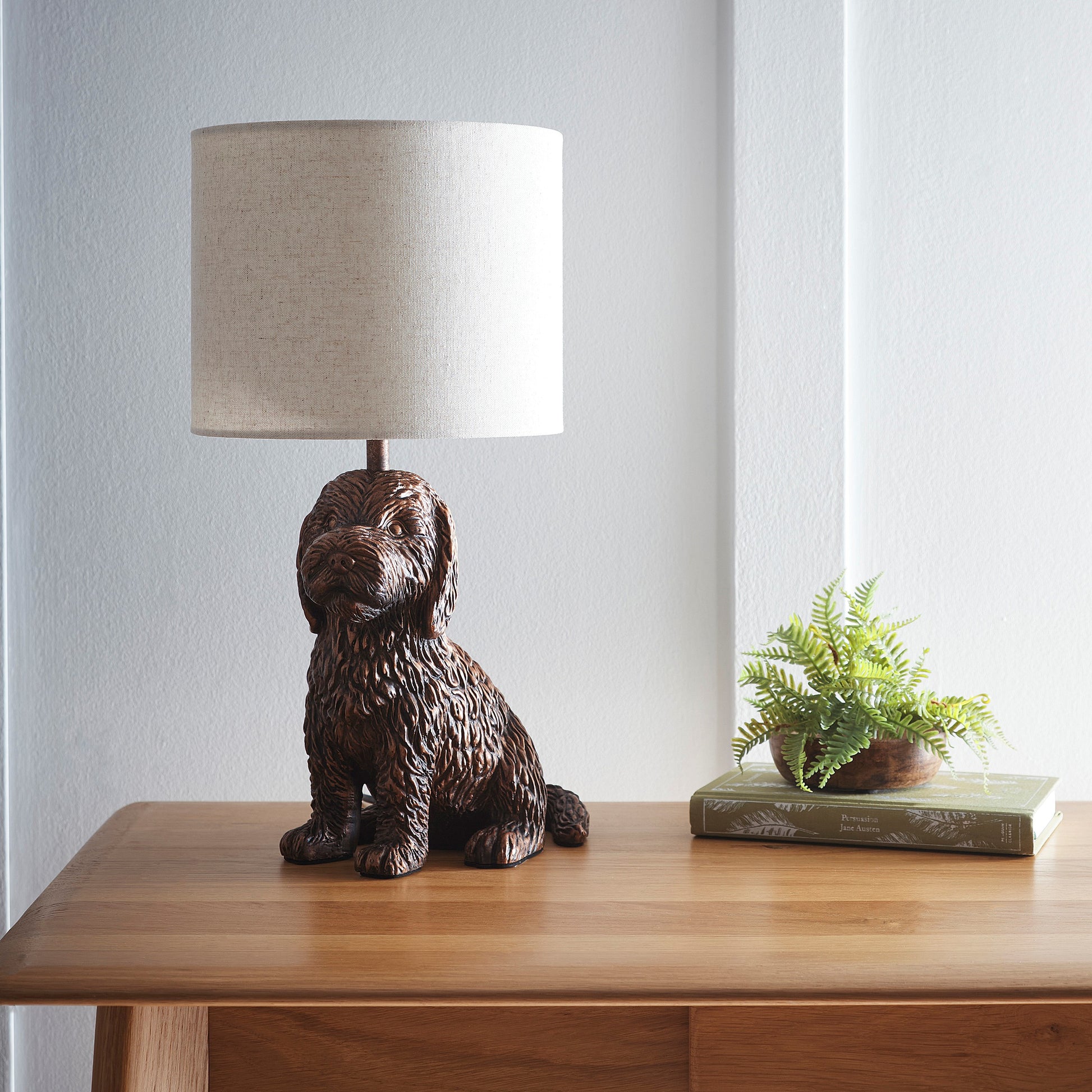 Puppy Animal Table Lamp in an Antique Copper Finish with a Natural Linen Shade