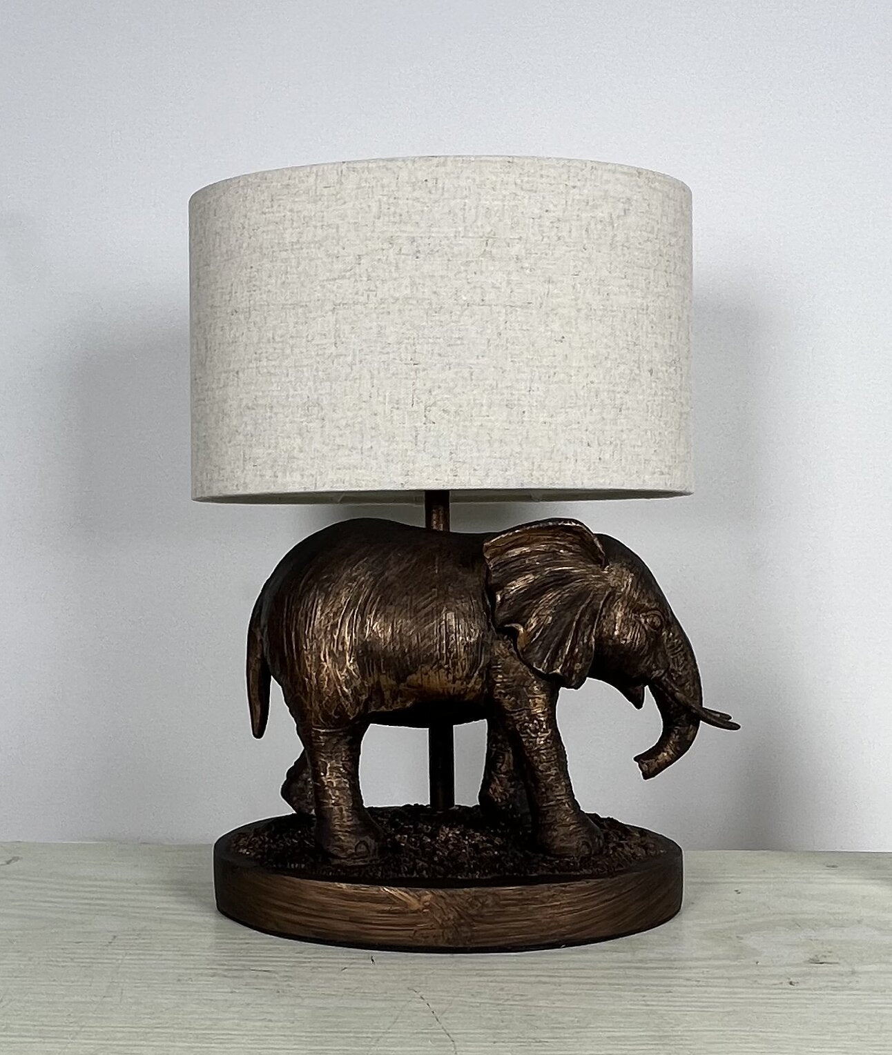 Elephant Lamp in an Antique Copper Resin Table Lamp with an Oval Natural Linen Shade