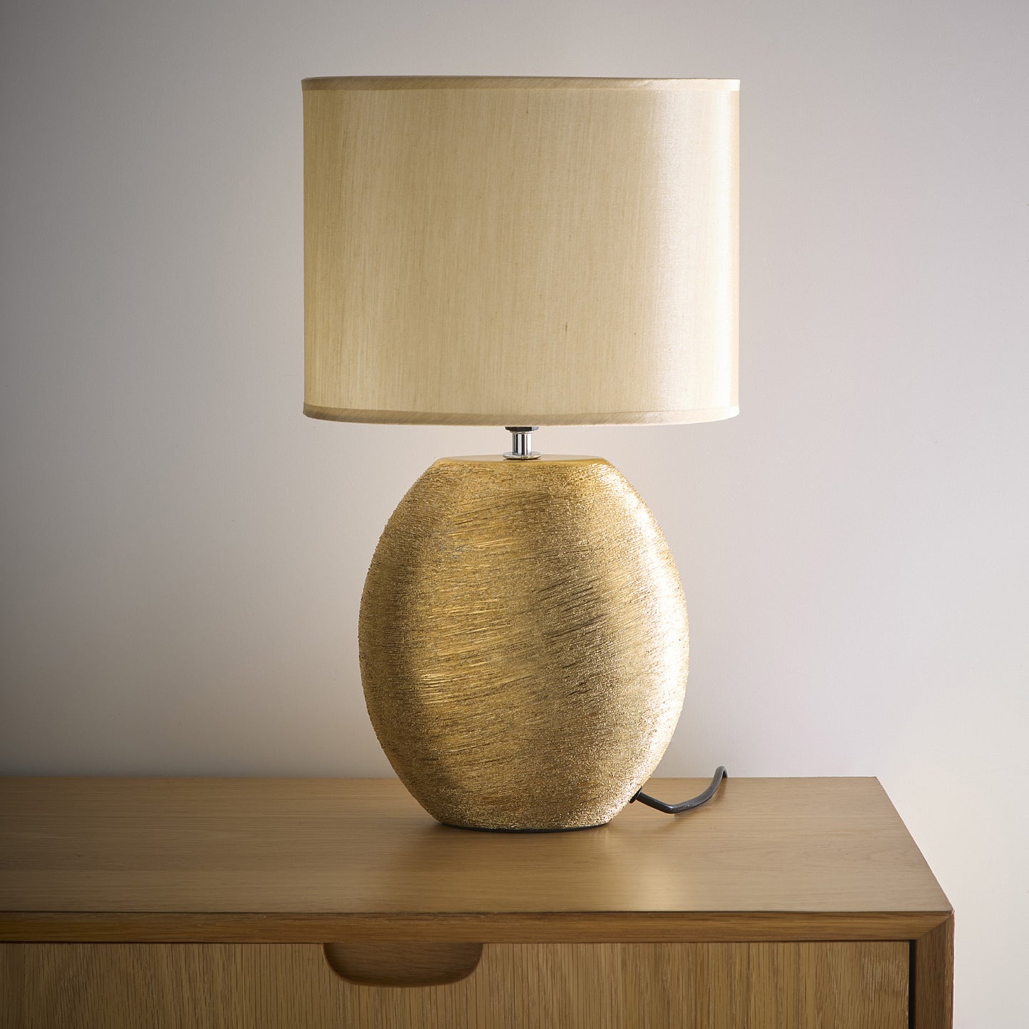 Waltham Gold Ceramic Table Lamp complete with a Champagne Gold Lamp shade