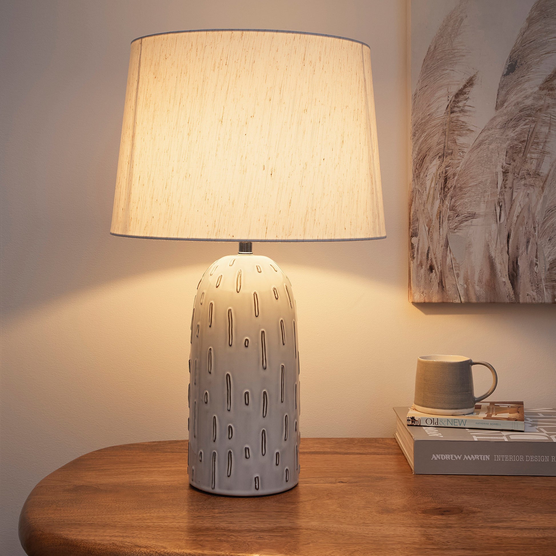 Modern Ceramic Table Lamp in a Soft White Base Finish with a Natural Linen Shade