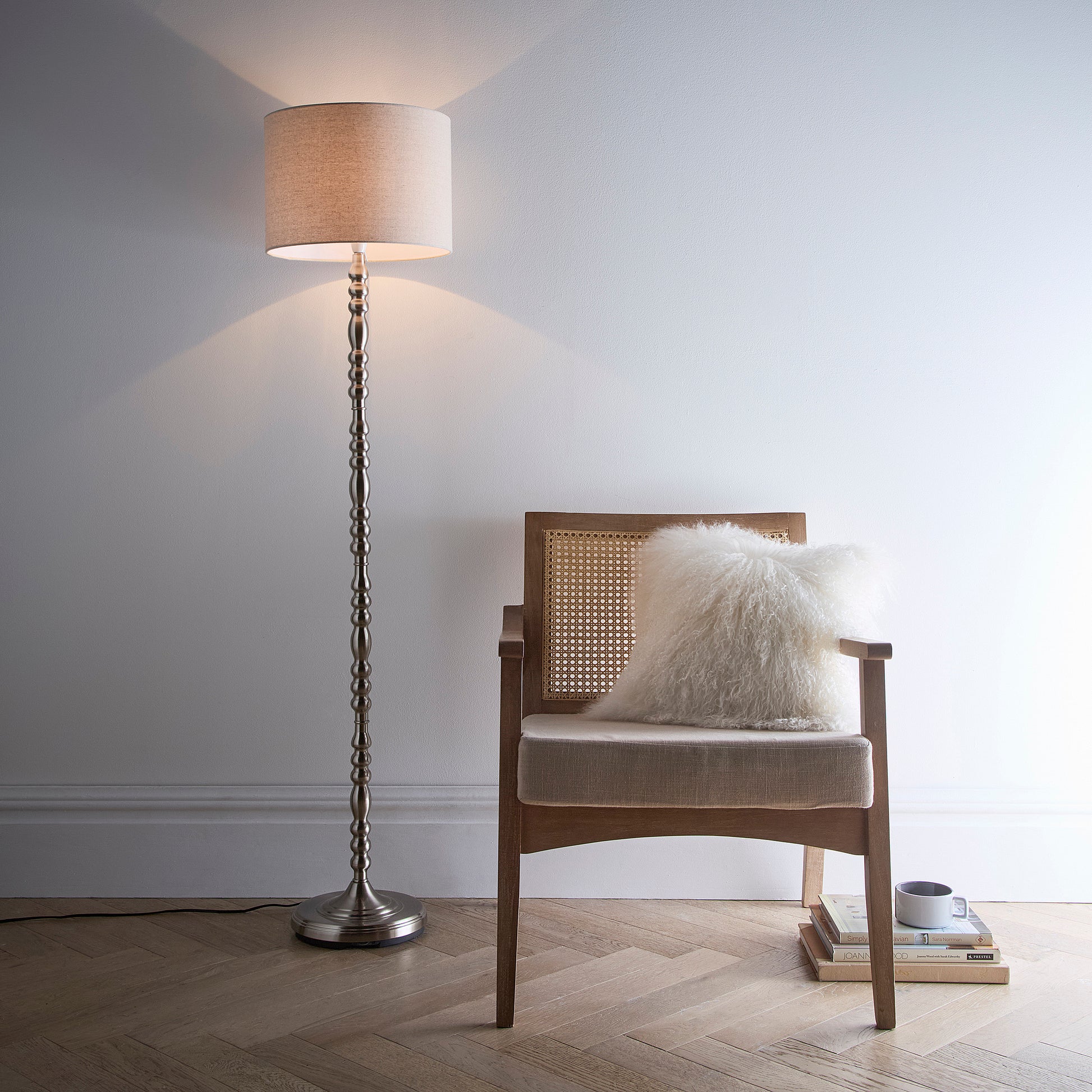 Floor Lamp in a Ribbed Satin Nickel finish on a tall candlestick design base with a Natural Linen Lampshade